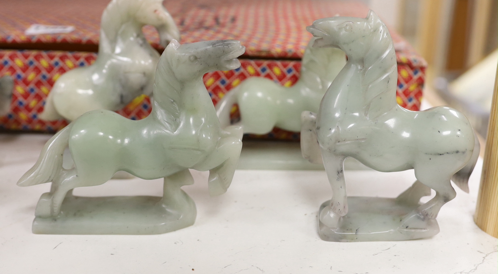 A set of eight Chinese hardstone figures of the horses of Mu Wang